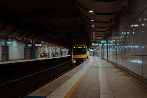 Train approaching the platform at Green Square Station - Australian Stock Image