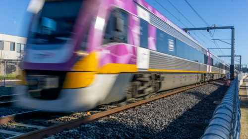 Train moving along tracks in Melbourne - Australian Stock Image