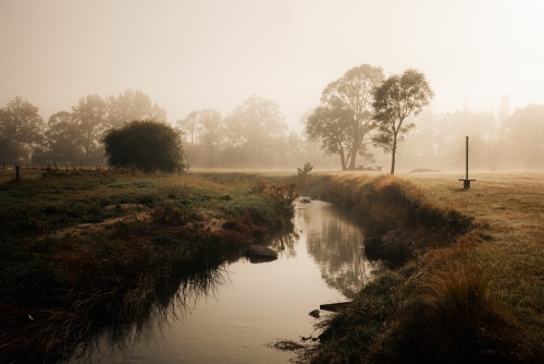 Tranquil creek on foggy winter morning at Lithgow NSW - Australian Stock Image