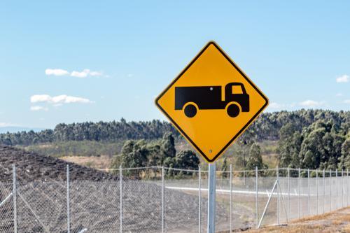 Truck Road Sign with Fencing Behind - Australian Stock Image