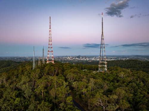 TV towers on hill with Brisbane City behind - Australian Stock Image