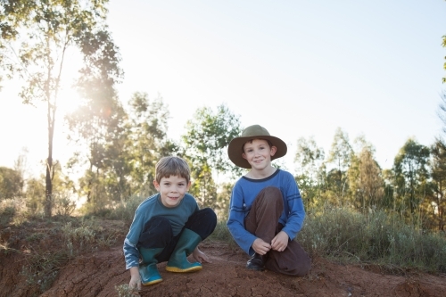 Two happy Aussie kids looking at camera with copy space - Australian Stock Image