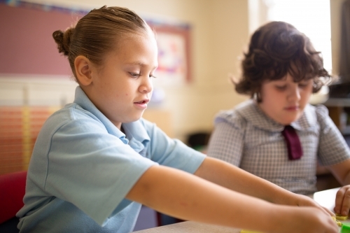 Two primary school girl students in a classroom - Australian Stock Image