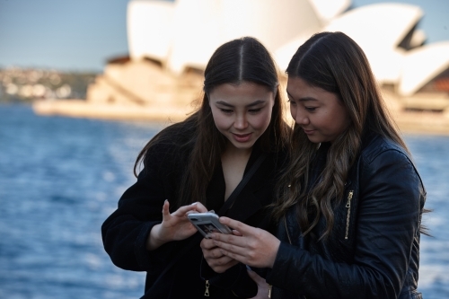 Two sisters spending time together harbourside - Australian Stock Image