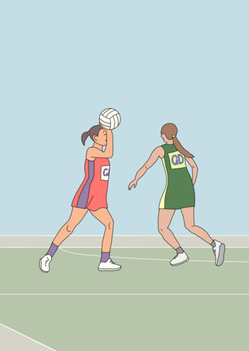 Two women in action on netball court on game day - Australian Stock Image