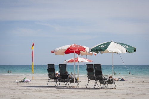 Umbrellas and deckchairs on beach - Australian Stock Image