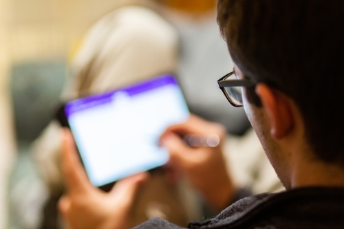 Uni student using tablet for study - Australian Stock Image