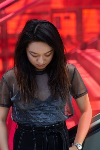urban portrait of young Asian woman - Australian Stock Image