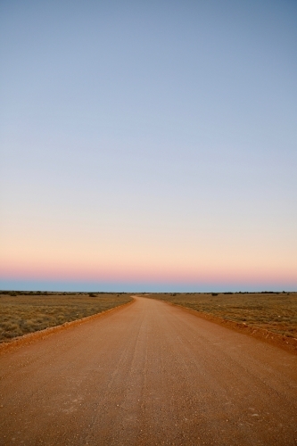 Vertical shot of a dusty road at sunset - Australian Stock Image