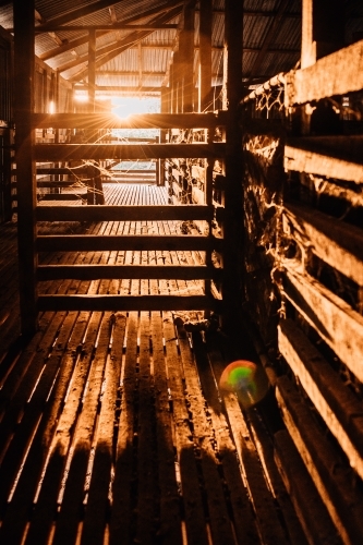 Vertical shot of wooden shearing shed with sunlight - Australian Stock Image