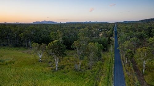 View above Schilling Lane, Calliope, with Mount Larcom in the background. - Australian Stock Image