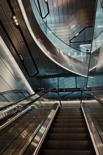 View from an escalator in a futuristic looking interior - Australian Stock Image