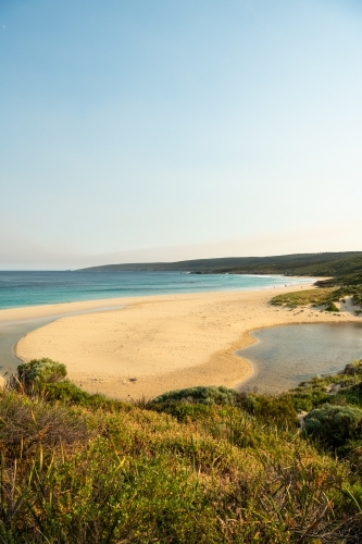 view of beach and ocean from top of sand dune - Australian Stock Image