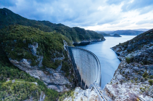 View of the Gordon Dam on a cool summer's day. It is a unique double curvature concrete arch dam - Australian Stock Image