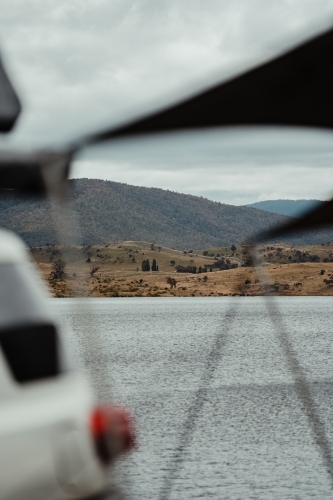 View over Lake Jindabyne while camping on overcast day - Australian Stock Image