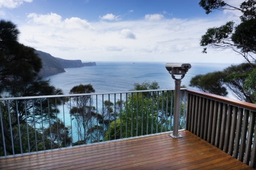 Viewing platform with railing over Tasman Peninsula coastline - Australian Stock Image