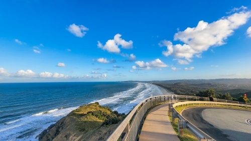 Walking path to the Cape Byron lighthouse overlooking Tallow Beach below, Byron Bay - Australian Stock Image