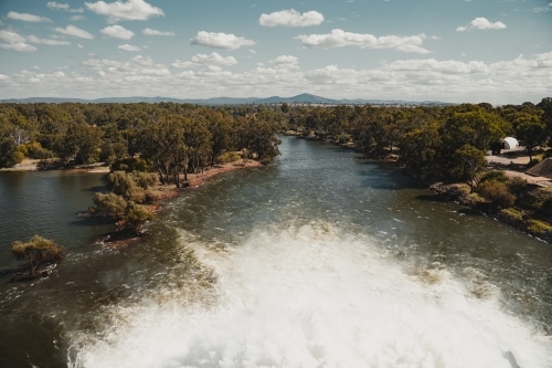 Water flowing from the Hume Dam wall into the Murray River towards Albury. - Australian Stock Image