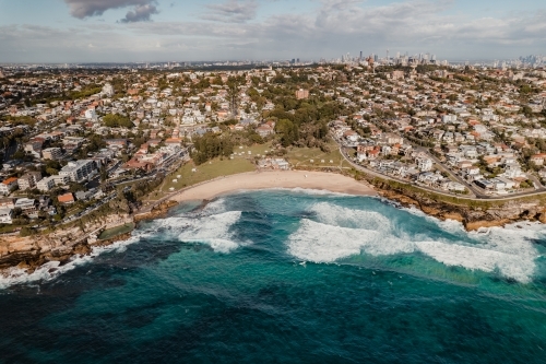 Waterfront properties looking over Bronte Beach, Sydney CBD in the background. - Australian Stock Image