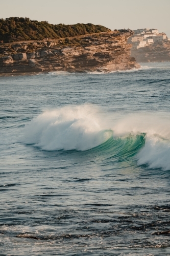 Wave crashing at Bronte Beach at sunrise - Australian Stock Image