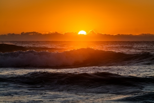 waves and beach at sunrise - Australian Stock Image