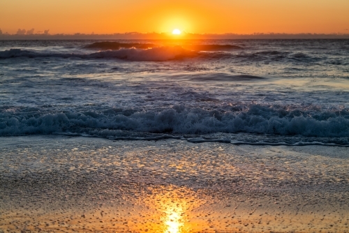 waves and beach at sunrise - Australian Stock Image