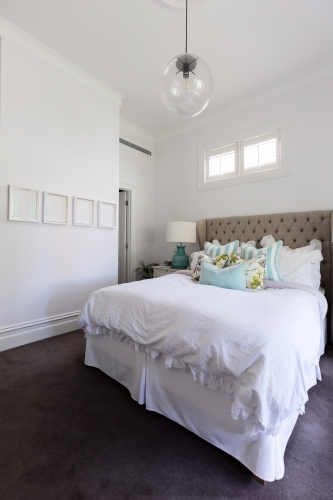 White and pastel blue styled country house bedroom - Australian Stock Image