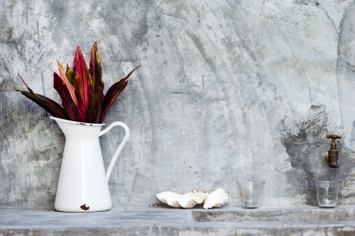 White and red interior decoration in a grey concrete room - Australian Stock Image