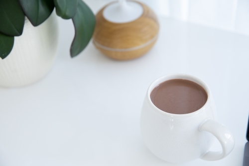 white hug mug with open desk space for text - Australian Stock Image