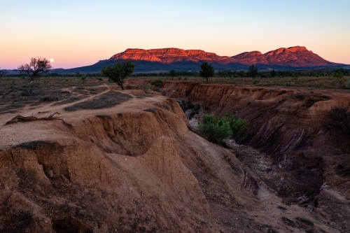 Wilpena Pound lit by rising sun - Australian Stock Image