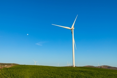 wind turbine against blue sky - Australian Stock Image