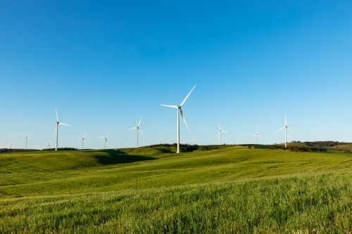 wind turbines on hills in farmland - Australian Stock Image