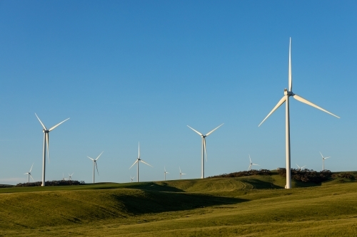 wind turbines on rolling farm land - Australian Stock Image