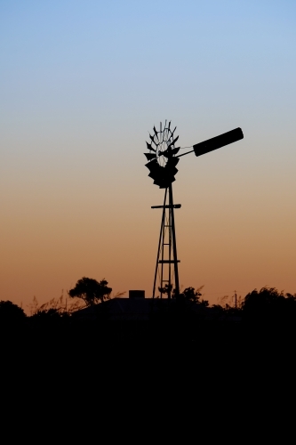 Windmill silhouette at dusk - Australian Stock Image