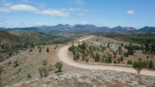 Windy dirt road leading through the Flinders Ranges - Australian Stock Image