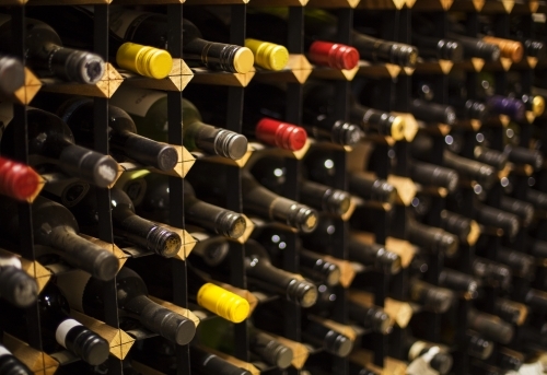 Wine bottles in wine rack - Australian Stock Image