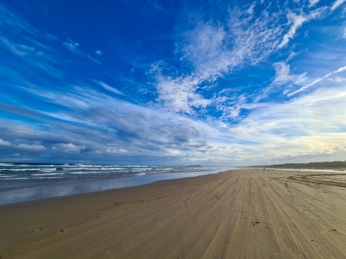 Wispy clouds above Coffs Harbour beach - Australian Stock Image