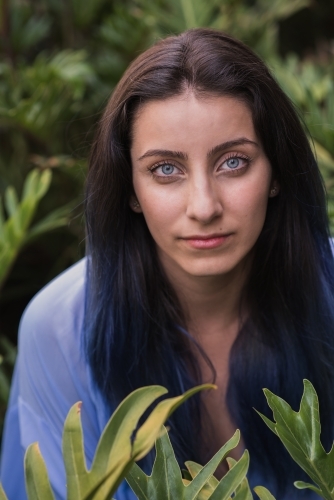woman amongst leaves - Australian Stock Image