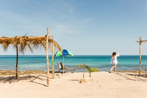 Woman at beach on summertime holiday - Australian Stock Image