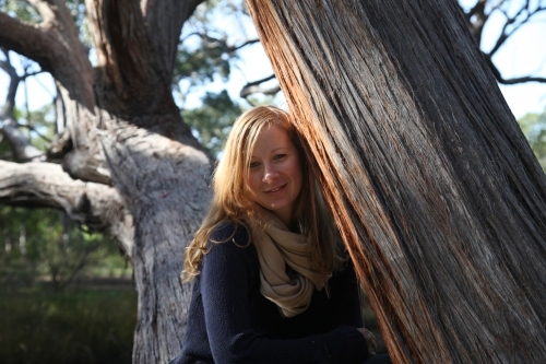 Woman beside tree - Australian Stock Image