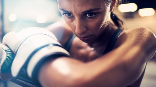 Woman boxing training at gym - Australian Stock Image