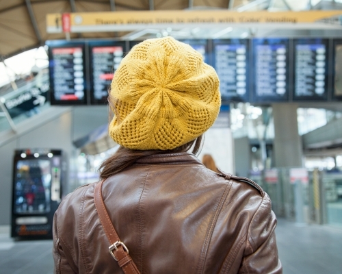 Woman reading the Railway Timetable - Australian Stock Image