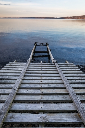 wooden boat ramp into water