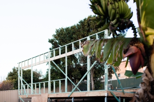 wooden frame of granny flat second dwelling under construction in backyard - Australian Stock Image