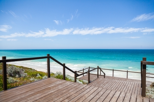 Wooden steps leading to coastal lookout and down to a pristine beach - Australian Stock Image