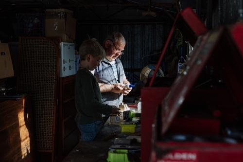 Woodworking with grandad in the shed - Australian Stock Image