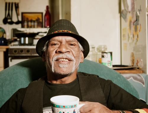 Wurundjeri Elder Sitting Back with a Cuppa - Australian Stock Image