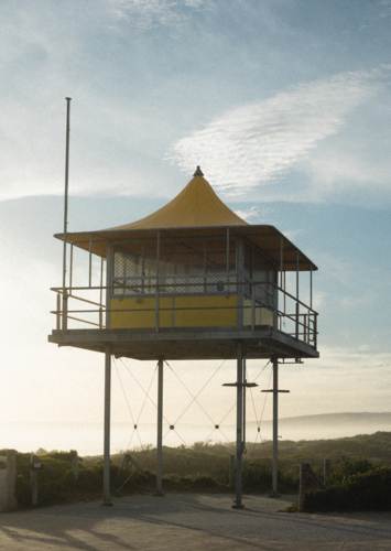 Yellow life saver hut at Goolwa Beach - Australian Stock Image