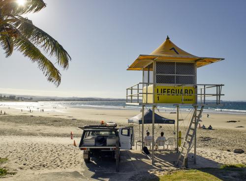 Yellow surf life savers hut at Rainbow Bay - Australian Stock Image