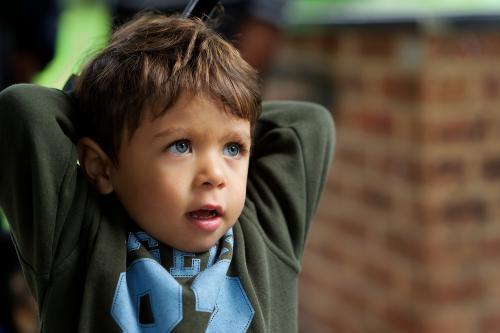 Young Aboriginal Boy in Green Top - Australian Stock Image